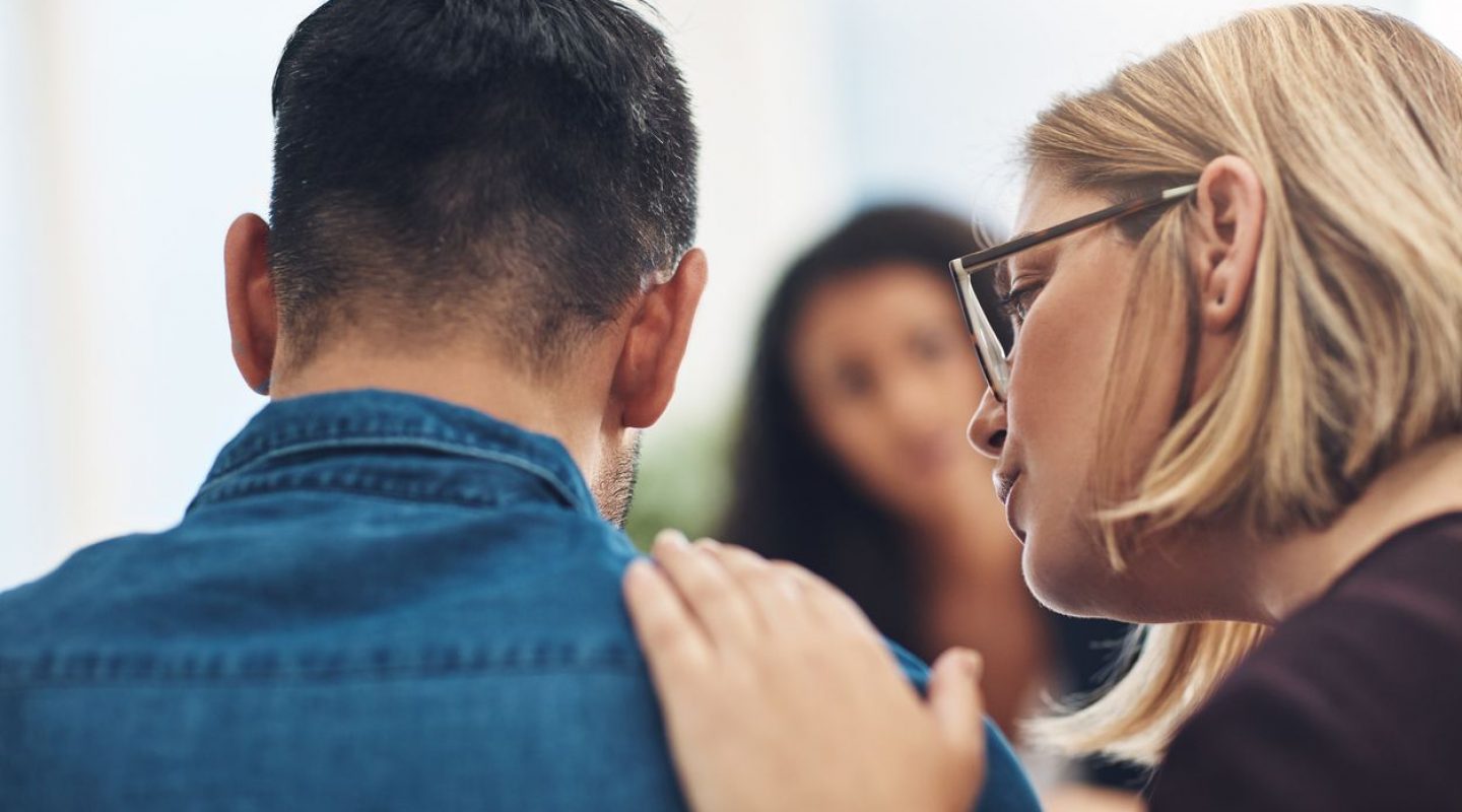 I know it hurts and I’m here for you Shot of a wife consoling her husband during a counseling session with a therapist
